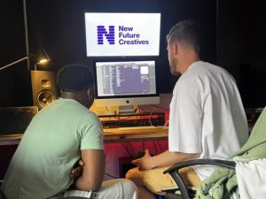 Image of NFC team working on music in the studio